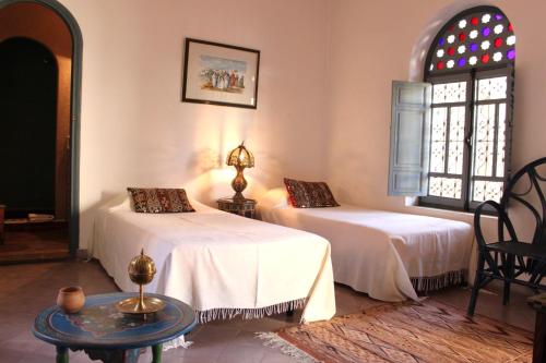 Cama o camas de una habitación en Riad Sahara Nour