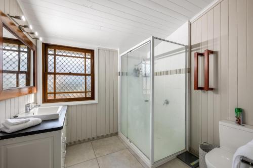 a bathroom with a shower and a sink at Elegant, Stunning & Central! East Side Gem! in Toowoomba