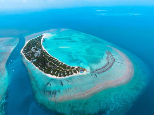 an island in the middle of the ocean at Hideaway Beach Resort & Spa in Dhidhdhoo