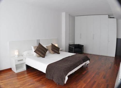 Postel nebo postele na pokoji v ubytování Glasir Apartments Barcelona
