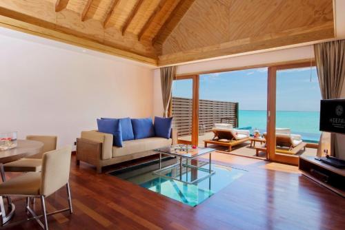 a living room with a view of the ocean at Hideaway Beach Resort & Spa, FREE SHARED CHARTER FLIGHT for two on stays of 7 or more nights from September 2025 until 23rd December 2026 in Dhidhdhoo