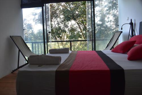 Una cama o camas en una habitación de Kakulanda Resort