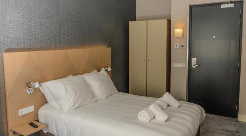 Cama o camas de una habitación en Amadi Panorama Hotel