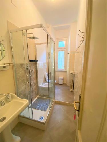 a bathroom with a shower and a sink at Villa Silvana in Perledo