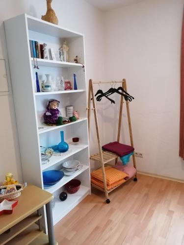 a room with a book shelf and a ladder at Monteurwohnung App 2 in Pirmasens