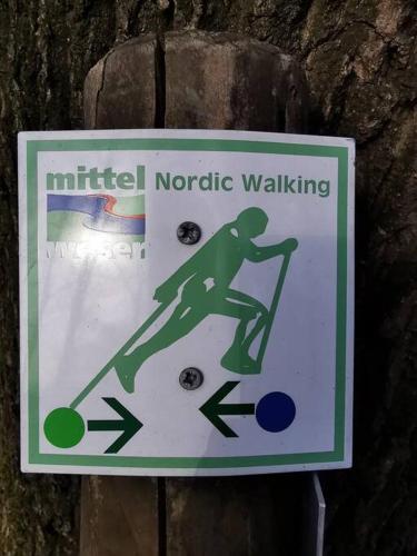 a sign on a tree that saysauthorized narcotic walking at Xanadi Heilehaus kleine Auszeit Kururlaub in Bruchhausen-Vilsen