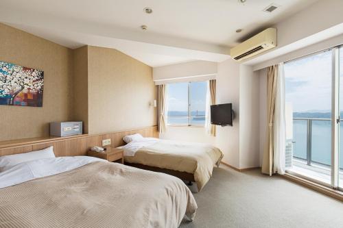 Postel nebo postele na pokoji v ubytování Samson Hotel