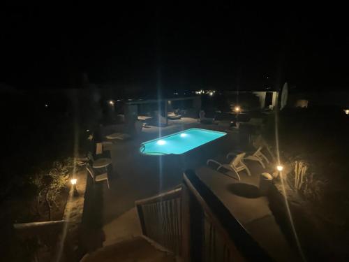 a view of a swimming pool at night at Sakas Residences in Karterados