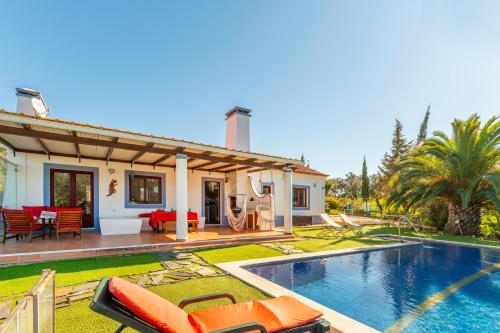 a villa with a swimming pool and a house at Sierra Melides Villa,Alentejo, BR2 with private pool, BR3 with private pool - near beach in São Francisco da Serra