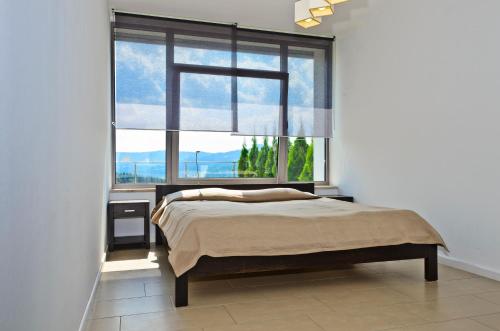 Postel nebo postele na pokoji v ubytování Apartamenty Sun & Snow Bukowa Góra