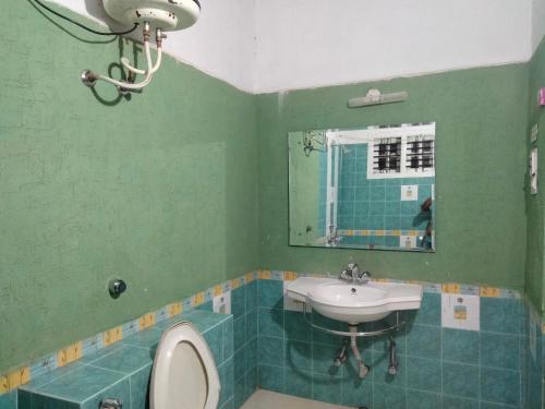 Ett badrum på Prashanth Homestay