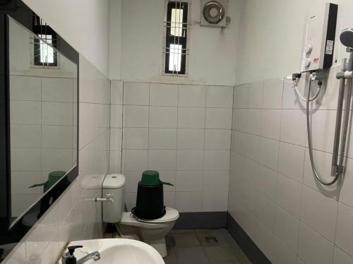 a bathroom with a toilet and a sink and a shower at Seribu 1 Homestay 4 Room House in Kundasang