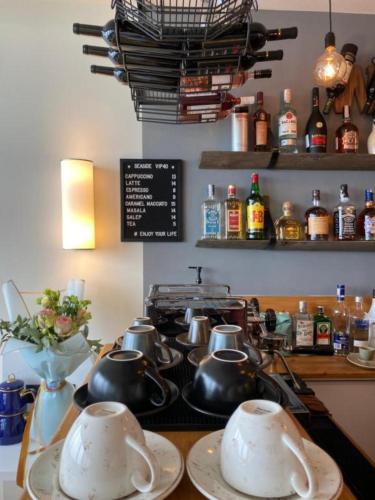 a kitchen with pots and pans on a stove at Superior Apartments Orbi City Sea View in Batumi
