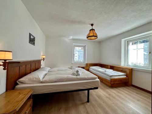 Postel nebo postele na pokoji v ubytování Central Apartment Canazei