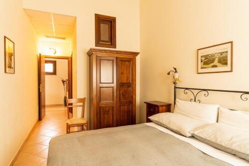 Кровать или кровати в номере Agriturismo Il Giglio