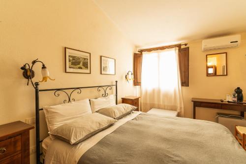 Кровать или кровати в номере Agriturismo Il Giglio