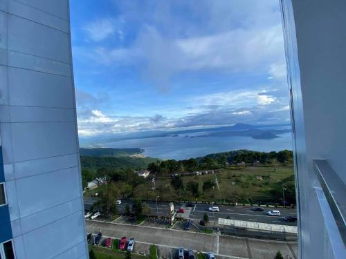 a view of the water from a building at Bella Suites at Wind Residences Tagaytay in Tagaytay