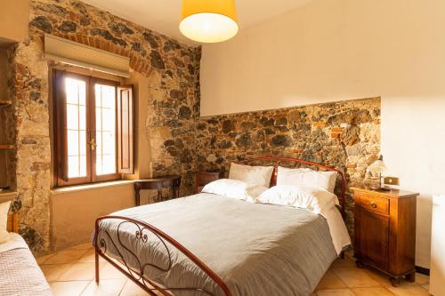 Кровать или кровати в номере Agriturismo Il Giglio