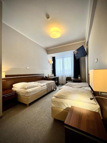 Postel nebo postele na pokoji v ubytování Hotel Szyndzielnia