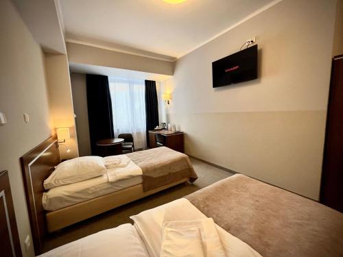 Postel nebo postele na pokoji v ubytování Hotel Szyndzielnia