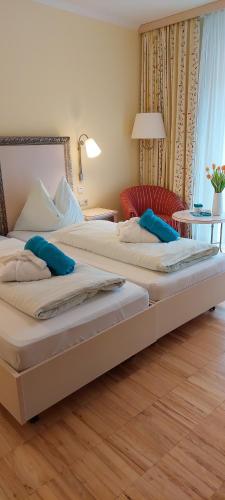 Un pat sau paturi într-o cameră la Gesundheits- & Wellness Resort Weissenbach