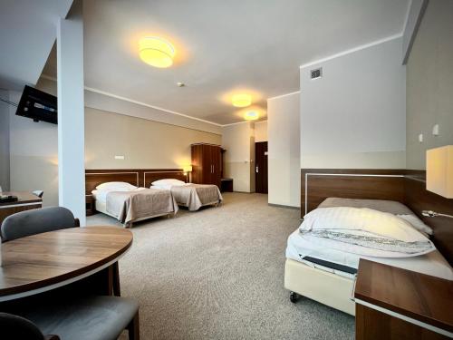 Postel nebo postele na pokoji v ubytování Hotel Szyndzielnia