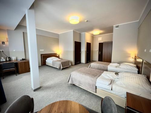 Postel nebo postele na pokoji v ubytování Hotel Szyndzielnia
