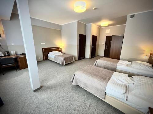 Postel nebo postele na pokoji v ubytování Hotel Szyndzielnia