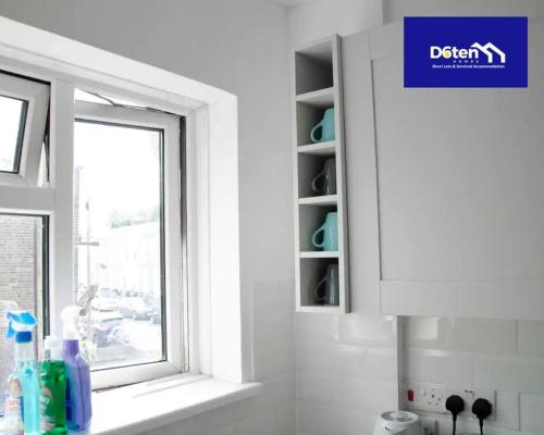 a window in a kitchen with a sink and a window at Sleeps 7x Weekly, Monthly Discounts x Free Parking in Forest Hill