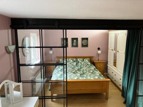 a bedroom with a bed with a glass wall at Lovely family seafront property in Burnham-on-Sea in Burnham on Sea