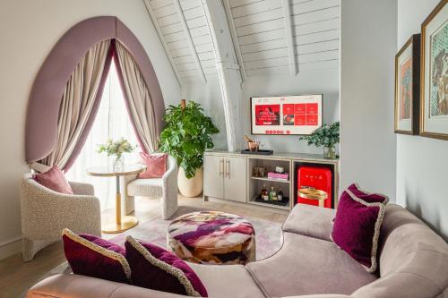 a living room with a couch and a table at Virgin Hotels Edinburgh in Edinburgh