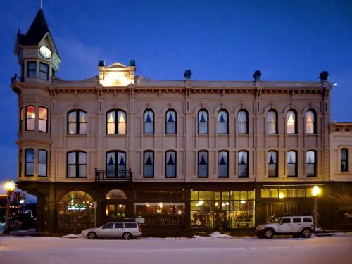 a large building with a clock tower on top of it at Geiser Grand Hotel in Baker City