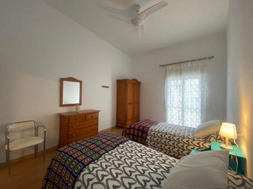 Postel nebo postele na pokoji v ubytování Casa Abuela Francisca