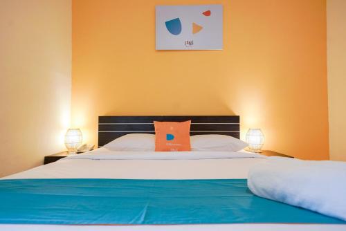 Ένα ή περισσότερα κρεβάτια σε δωμάτιο στο Sans Sunset Point Seminyak