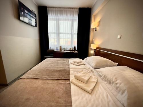 Postel nebo postele na pokoji v ubytování Hotel Szyndzielnia
