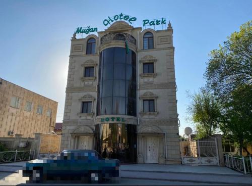 a building with a sign on top of it at MUGHAN PARK HOTEL in Sabirabad