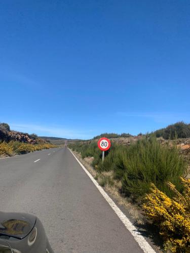 a speed limit sign on the side of a road at Pensão Fernandes in Porto Moniz