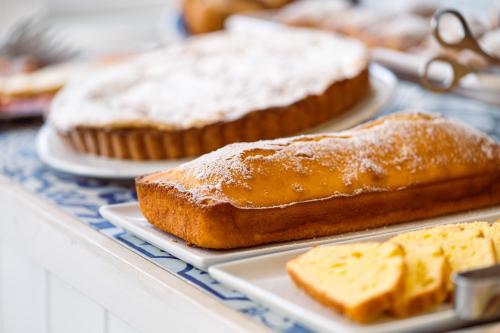 a group of breads on plates on a table at Hotel & Spa Relais Freedom Club in Massa Lubrense