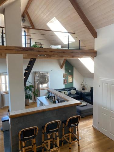 a kitchen and living room with a loft at Ferienwohnung d.d. Chalet in Aitrach