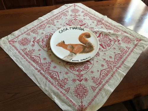 a plate with a squirrel on top of a table at Casa Marida in Camigliatello Silano