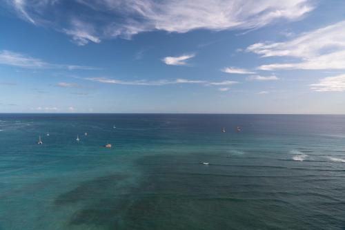 an aerial view of the ocean with boats in the water at Sheraton Waikiki Beach Resort in Honolulu