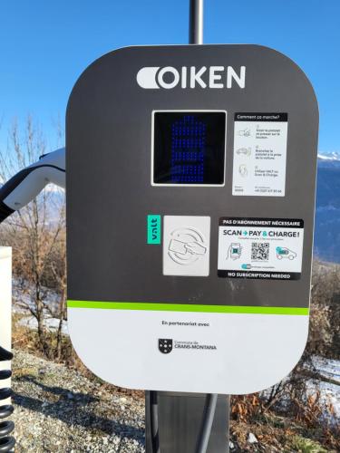a close up of a solar powered parking meter at Appartement Randogne avec grande terrasse in Crans-Montana