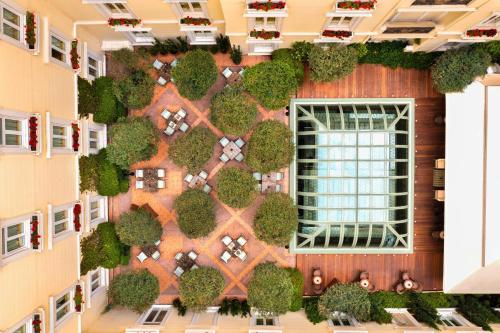 an overhead view of a building with a garden on it at Hotel Grande Bretagne, a Luxury Collection Hotel, Athens in Athens