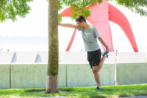 a man is running next to a tree at The Westin Seattle in Seattle