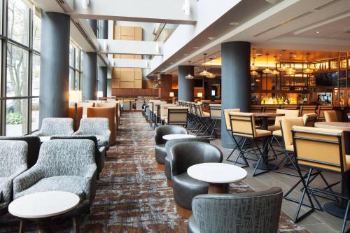 a restaurant with couches and tables and a bar at The Westin Seattle in Seattle