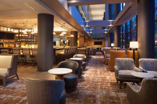 a restaurant with tables and chairs and a bar at The Westin Seattle in Seattle
