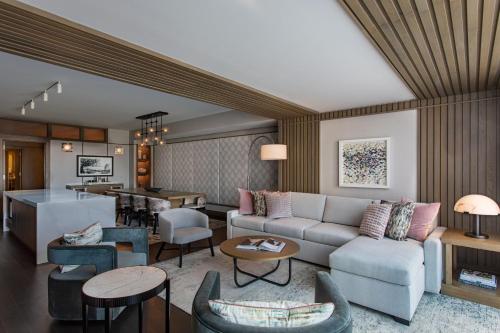 a living room with a couch and a table at JW Marriott Charlotte in Charlotte