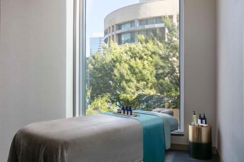 a window with a bed in a room with a view at JW Marriott Charlotte in Charlotte