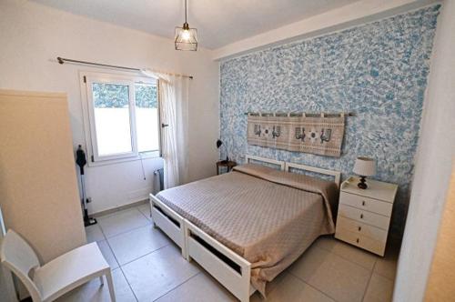 Postel nebo postele na pokoji v ubytování Portupaleddu Apartment