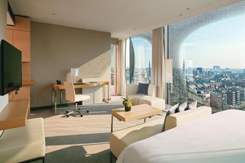 a hotel room with a view of a city at The Westin Hamburg in Hamburg